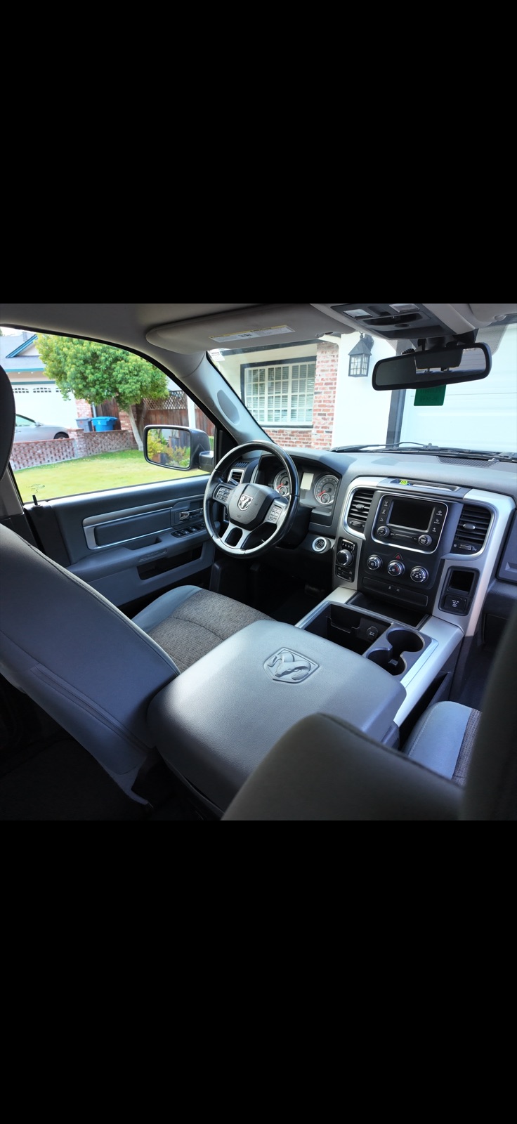 Cleaned center console, dashboard, and air vents of a Ram truck