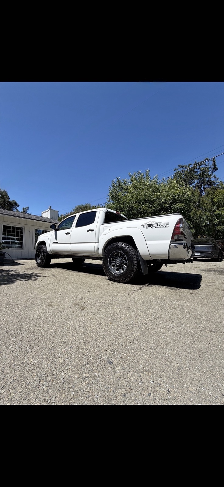 White Toyota Tacoma TRD detailed on a residential driveway